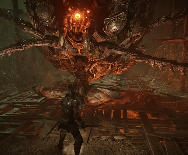 a screenshot of the game Demon Souls that shows a character in metal armour facing a spider like monster