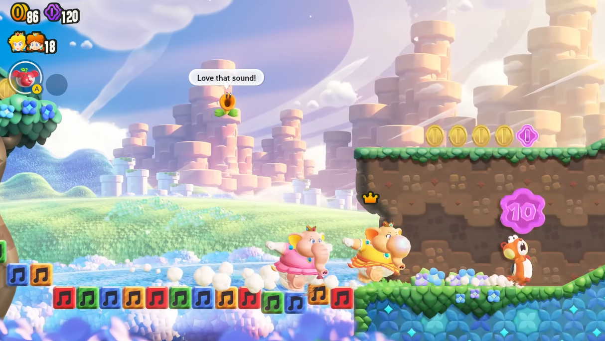 A screenshot of the game depicting peach and daisy as elephants racing through a colourful world